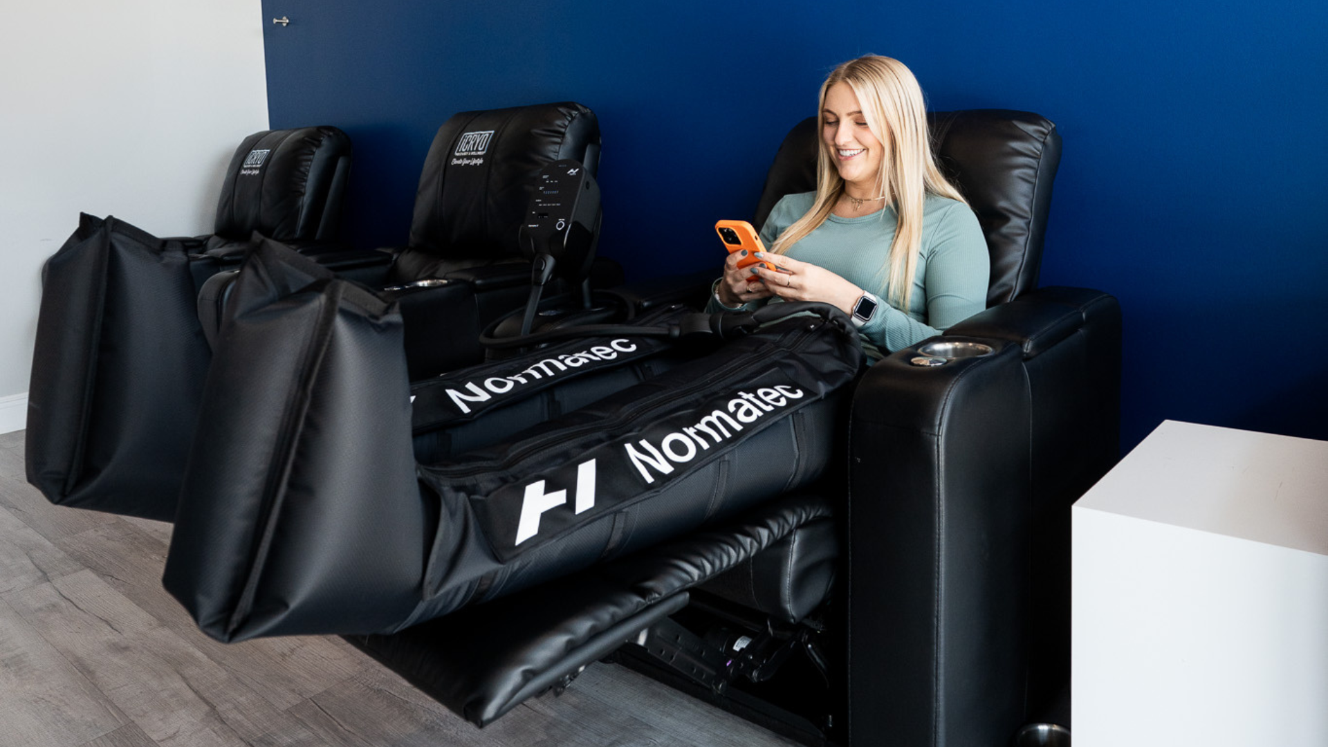 Person using compression therapy boots for athletic recovery