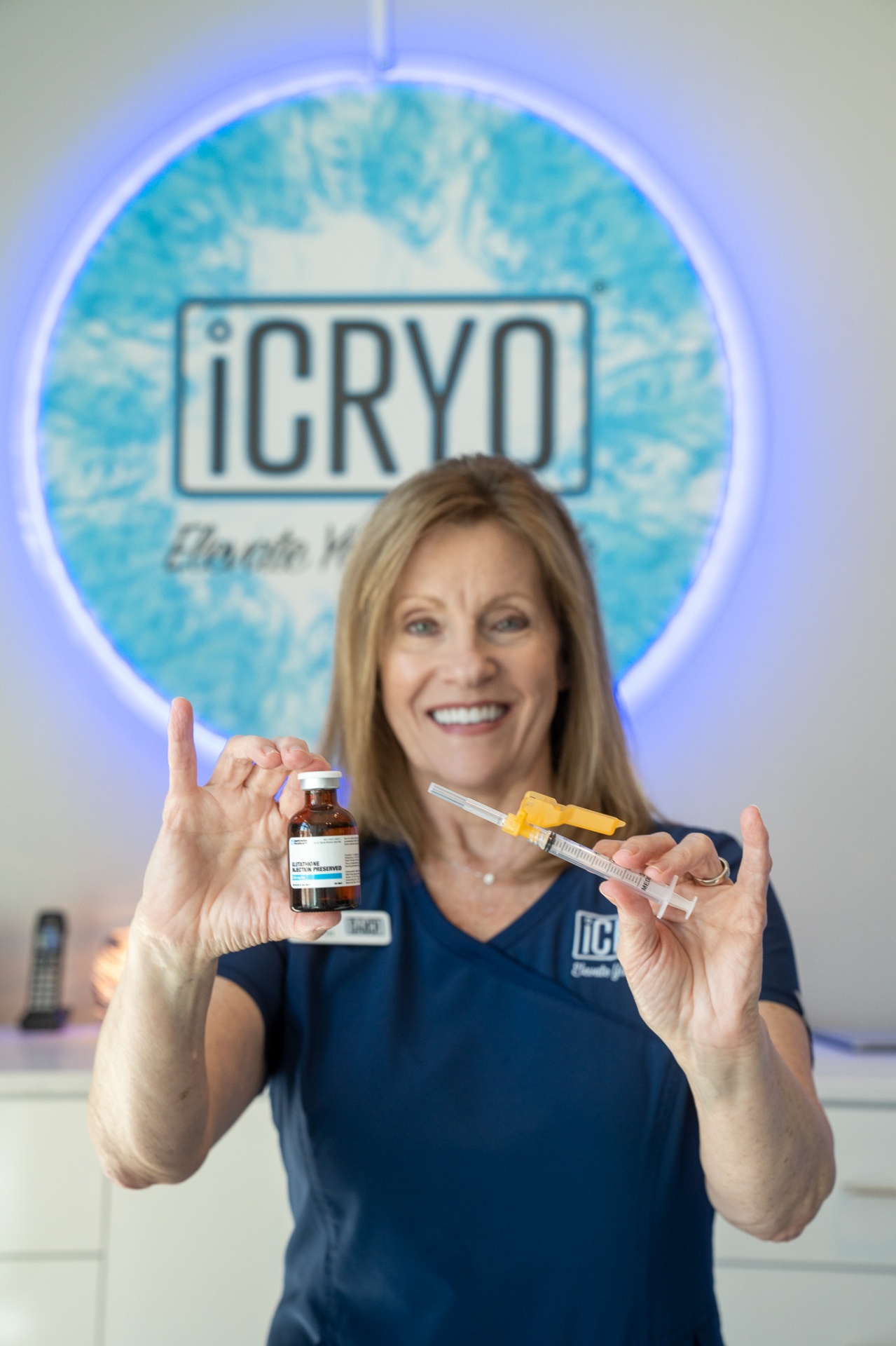 iCRYO Fairfield registered nurse holding glutathione IM shot vial and syringe